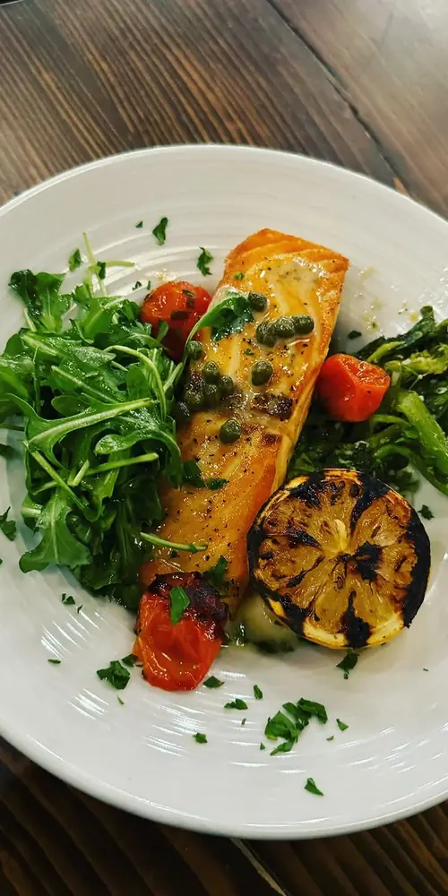 New Salmon dish added to our menu!
PAN ROASTED ATLANTIC SALMON SERVED OVER CHEESY PARMESAN POLENTA