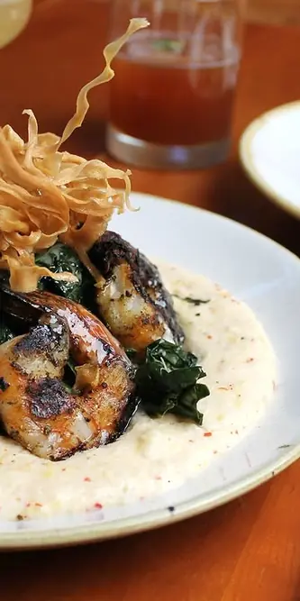 treat yourself to some shrimp & grits tonight
wood grilled shrimp served over chili grits with brai