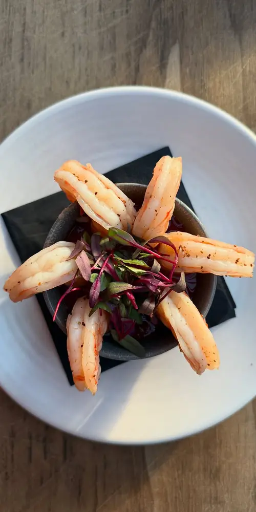 Light and simple to start, snack, or share: chilled Old Bay poached jumbo shrimp, spicy curry cockta