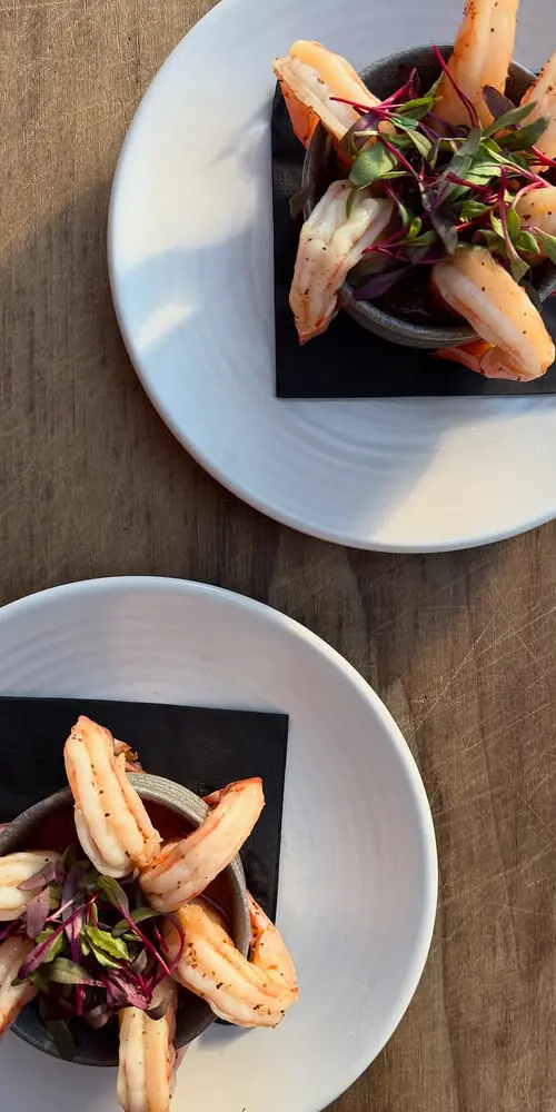 Light and simple to start, snack, or share: chilled Old Bay poached jumbo shrimp, spicy curry cockta