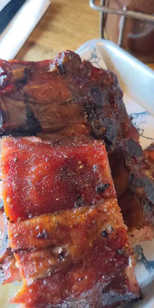 Half rack of ribs smoked to perfection, cornbread, Nashville hot cauliflower, apple-cabbage slaw, Ma