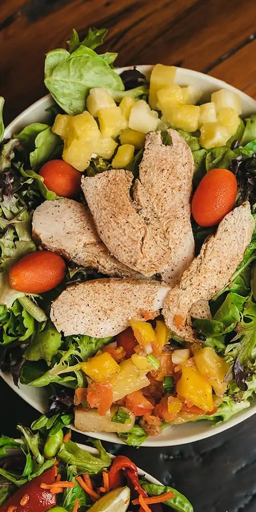 savor the flavors of summer with our Mango Pineapple Chicken Salad! 🌞🥭🍍 spiced, grilled all natural